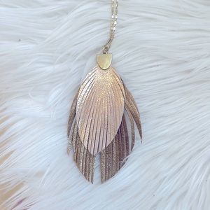 Necklace. Rose gold and bronze feather with a gold chain. Fashion jewelry